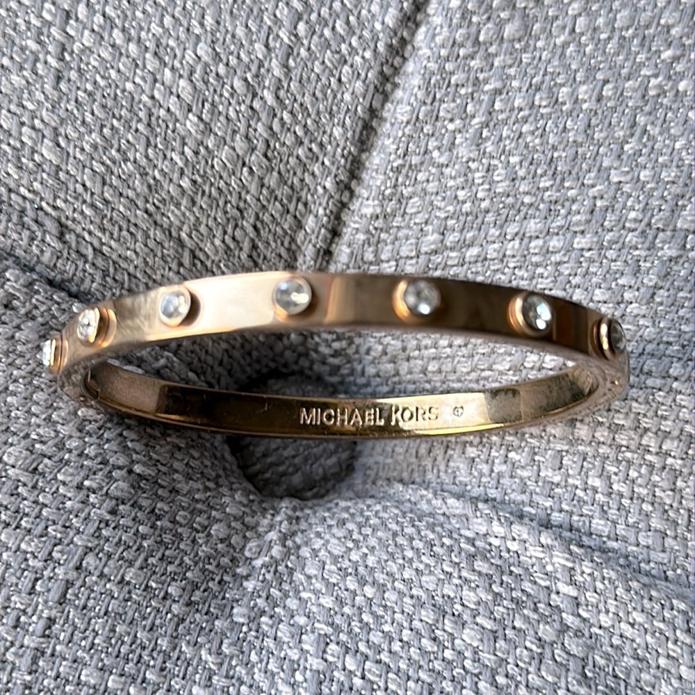 MK rosegold bracelet with stones all over.